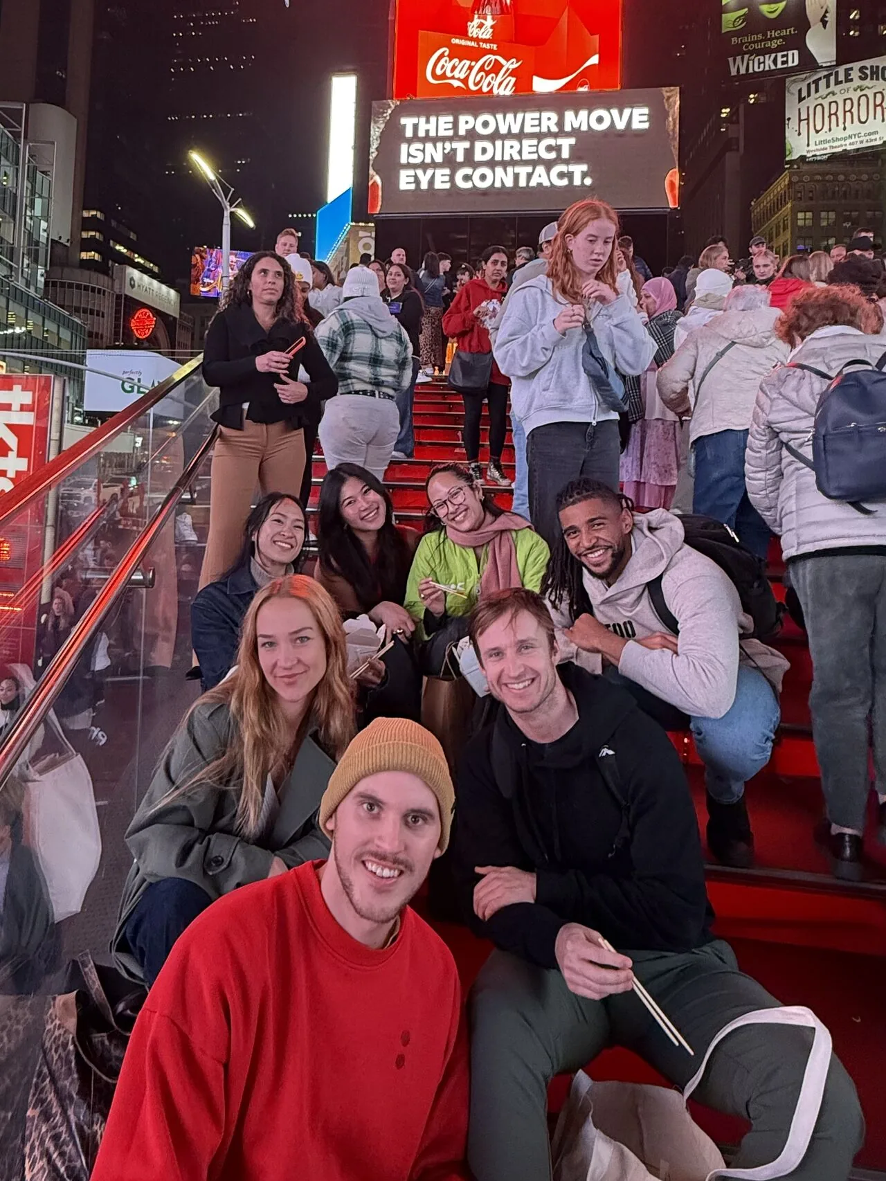 New York App Week attendees gathered on the red steps in Times Square
